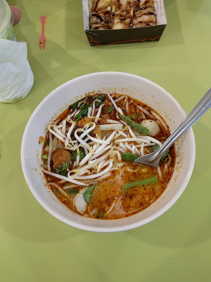 bowl of spicy thai noodle soup at platinum mall