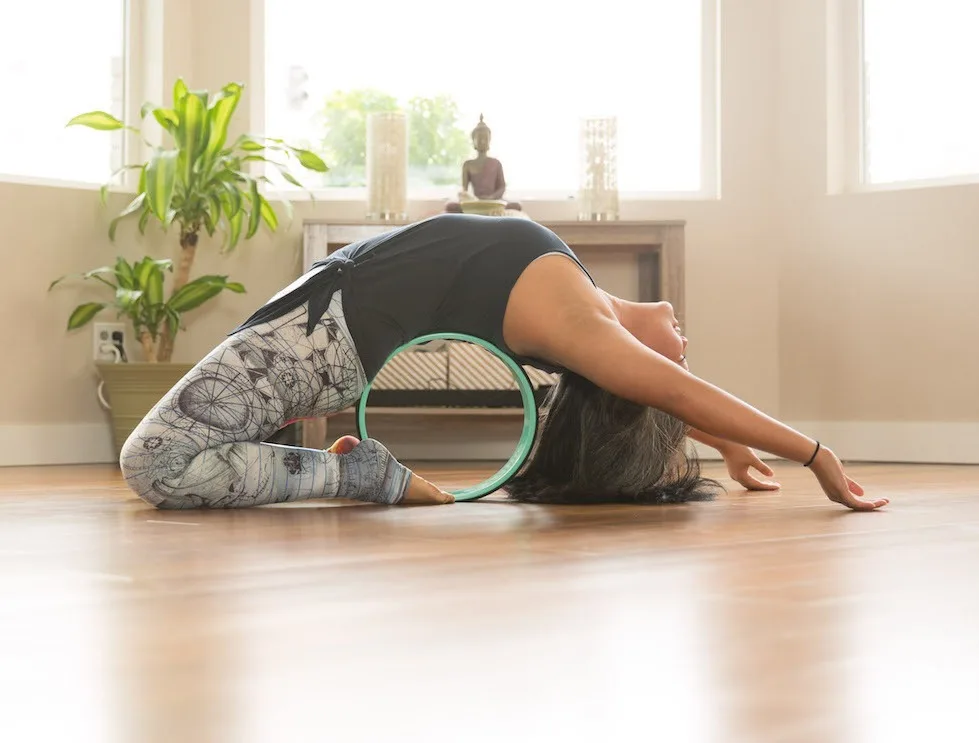 Kapotasana or King Pigeon with a Yoga Wheel