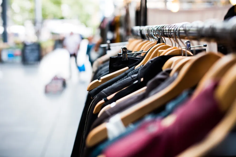 used clothing racks on a vintage sidewalk sale