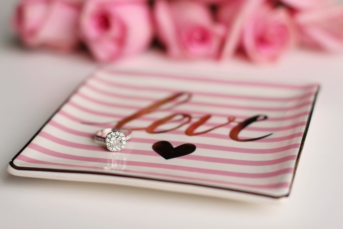 close up of a diamond ring on a jewelry tray