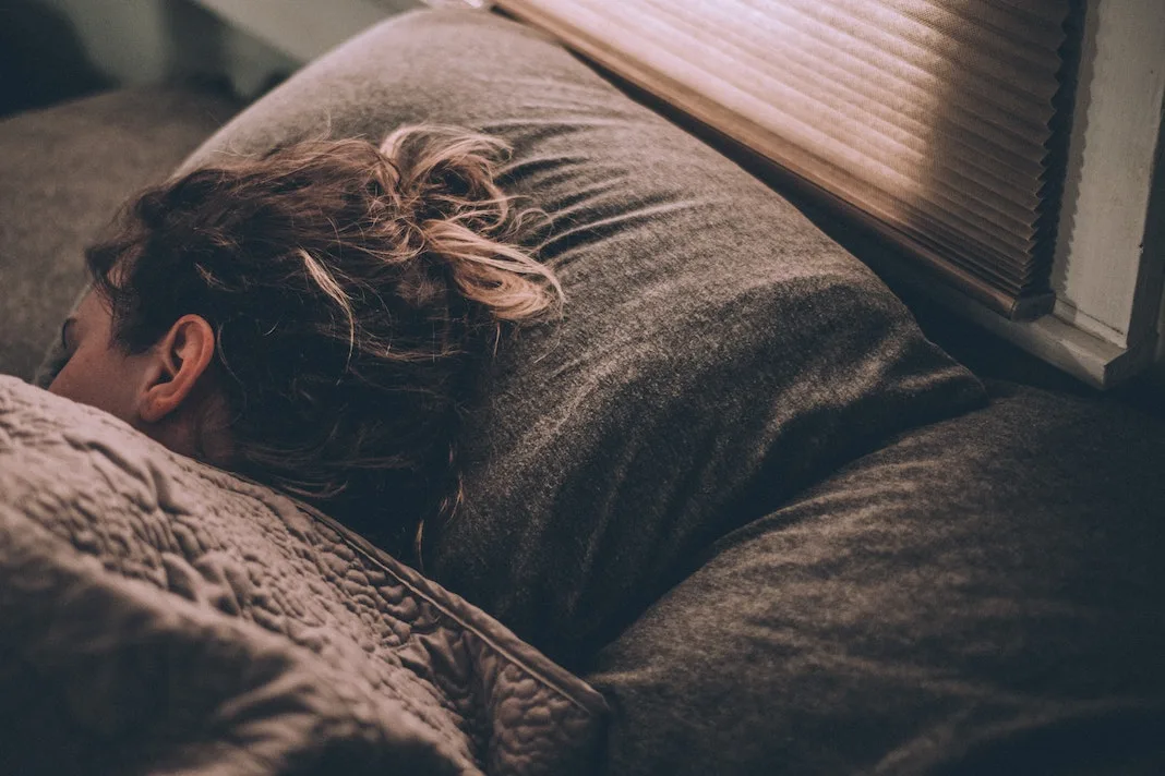 woman sleeping soundly in bed