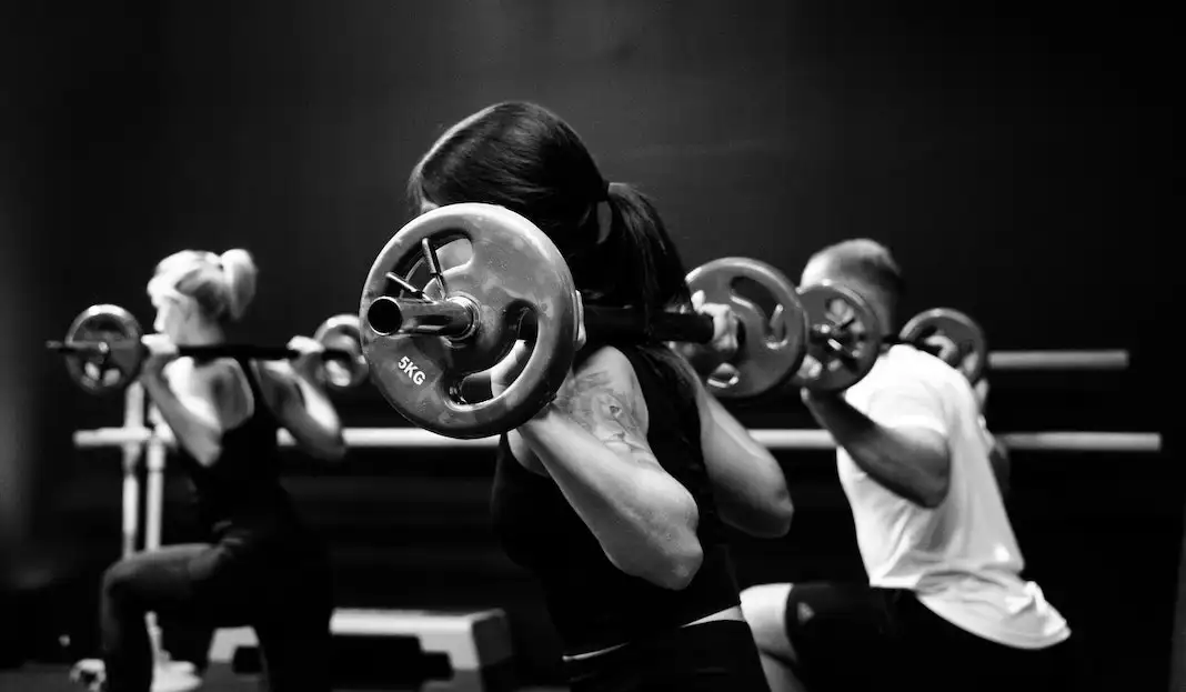 barbell workout class in gym fitness