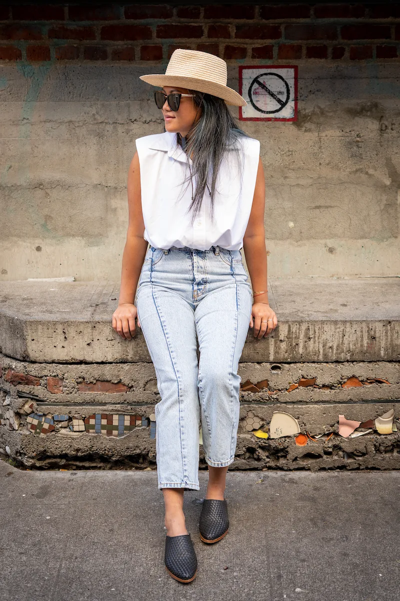 Wearing the Ona Sleeveless Shirt in white