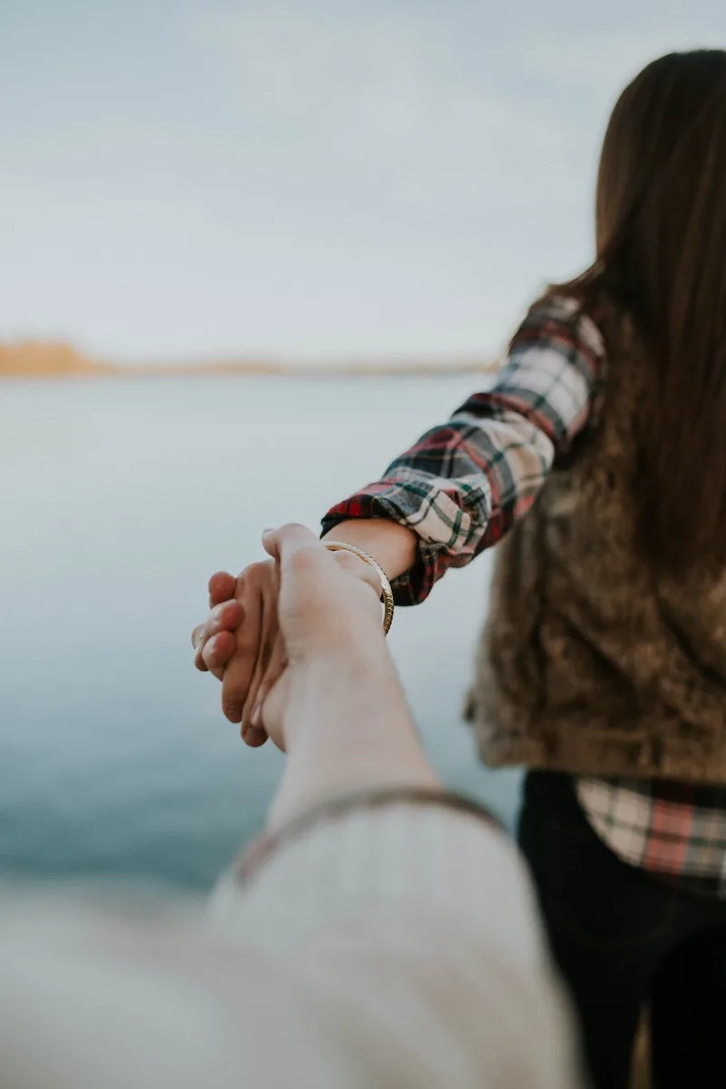 couple holding hands in nature