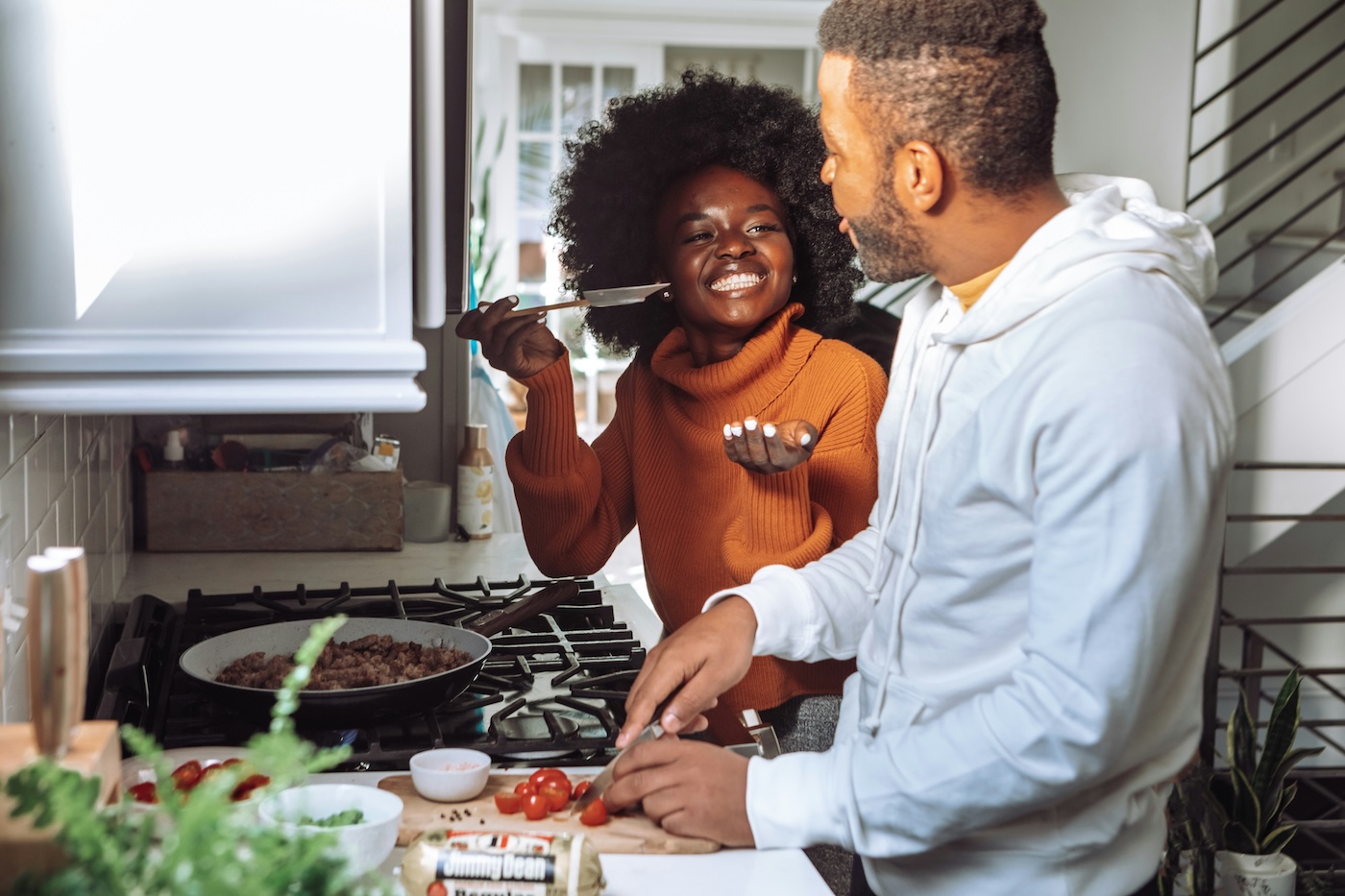 couple cooking together in class