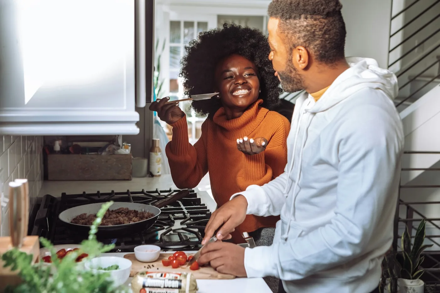 couple cooking together in class